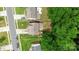 Aerial view of a suburban neighborhood showcasing neat lawns and proximity to lush trees at 8800 Darcy Hopkins Dr, Charlotte, NC 28277
