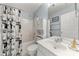 Bathroom featuring a shower-tub combo with decorative shower curtain and ample storage at 8800 Darcy Hopkins Dr, Charlotte, NC 28277