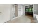 This bathroom showcases a glass enclosed shower and leads into the bedroom, highlighting practical elegance at 8800 Darcy Hopkins Dr, Charlotte, NC 28277