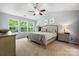 Inviting bedroom with lots of natural light, a ceiling fan, and neutral decor at 8800 Darcy Hopkins Dr, Charlotte, NC 28277
