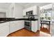 Kitchen with white cabinetry and stainless steel appliances at 8800 Darcy Hopkins Dr, Charlotte, NC 28277