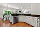 Kitchen with stone counters, stainless appliances, and a view of the dining area at 8800 Darcy Hopkins Dr, Charlotte, NC 28277