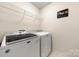 Laundry room featuring modern Maytag washer and dryer units at 8800 Darcy Hopkins Dr, Charlotte, NC 28277