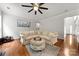 Cozy living room with hardwood floors, crown molding, and neutral decor at 8800 Darcy Hopkins Dr, Charlotte, NC 28277