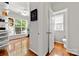 Home office showcasing wood floors and large windows overlooking the backyard at 8800 Darcy Hopkins Dr, Charlotte, NC 28277