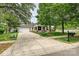 Charming home with well-manicured lawn, inviting front porch, and a spacious driveway leading to a two-car garage at 1000 Millbank Dr, Matthews, NC 28104