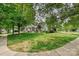 Charming home with well-maintained lawn, mature trees, and a welcoming front porch at 1000 Millbank Dr, Matthews, NC 28104