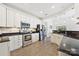 Bright kitchen offering stainless steel appliances, dark countertops, and white cabinets at 1000 Millbank Dr, Matthews, NC 28104