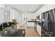 Spacious kitchen boasting stainless steel appliances, white cabinetry, and sleek granite countertops at 1000 Millbank Dr, Matthews, NC 28104