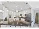 Kitchen featuring stainless appliances, white cabinets, granite countertops, and pendant lighting at 1000 Millbank Dr, Matthews, NC 28104