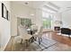A dining area that offers natural light, and has a fireplace in the corner of the room at 1000 Millbank Dr, Matthews, NC 28104
