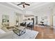Open-concept living room seamlessly connects to the kitchen and dining area, creating an ideal space for modern living at 1000 Millbank Dr, Matthews, NC 28104