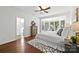 Bright main bedroom with hardwood floors, sitting area, and ensuite bathroom at 1000 Millbank Dr, Matthews, NC 28104