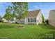 Expansive backyard boasts green grass, healthy trees, and a well-kept exterior at 10314 Threatt Woods Dr, Charlotte, NC 28277