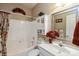 Cozy bathroom with a tub, shower, and a decorative mirror at 10314 Threatt Woods Dr, Charlotte, NC 28277