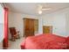 Cozy bedroom featuring carpeted floors, natural light, a ceiling fan, and closet at 10314 Threatt Woods Dr, Charlotte, NC 28277