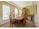 Dining room featuring natural light, traditional decor, and a neutral color palette at 10314 Threatt Woods Dr, Charlotte, NC 28277