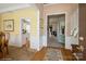 Open hallway featuring hardwood floors, neutral paint, and decorative accents at 10314 Threatt Woods Dr, Charlotte, NC 28277