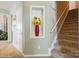Hallway featuring carpeted stairs and built-in display niche with flowers at 10314 Threatt Woods Dr, Charlotte, NC 28277