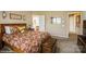 Spacious main bedroom featuring a decorative bedspread, dresser, and carpeted floors at 10314 Threatt Woods Dr, Charlotte, NC 28277