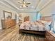 Spacious main bedroom boasts a tray ceiling, wood floors, and natural light at 1050 Coppergate Dr, Salisbury, NC 28147