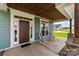 Inviting front porch with rocking chairs and a stained wood ceiling, perfect for relaxing at 1050 Coppergate Dr, Salisbury, NC 28147