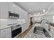 Bright kitchen with white cabinets, granite countertops, and a view into the adjacent dining area at 1050 Coppergate Dr, Salisbury, NC 28147