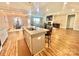 Open concept kitchen with an island that has barstool seating and an overview of the living spaces at 1050 Coppergate Dr, Salisbury, NC 28147
