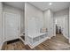 Inviting mudroom with bench seating and coat hooks offers a convenient entry point at 1050 Coppergate Dr, Salisbury, NC 28147