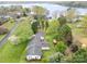 Aerial view of property with mature trees and landscaping and glimpses of the lake at 106 S Oakwood Dr, Kings Mountain, NC 28086