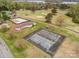 Aerial view of neighborhood amenities, featuring a pool, tennis courts, and golf course at 106 S Oakwood Dr, Kings Mountain, NC 28086