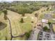 Aerial view of a golf course, community amenities and residential houses near the lake at 106 S Oakwood Dr, Kings Mountain, NC 28086