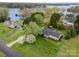 Lake view of a waterfront house with flowering trees and mature landscaping at 106 S Oakwood Dr, Kings Mountain, NC 28086