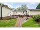Nice backyard featuring a brick patio area with outdoor seating and beautiful landscaping at 106 S Oakwood Dr, Kings Mountain, NC 28086