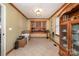 Dining room with wood trim, tiled floors, a built-in bar and display cabinet at 106 S Oakwood Dr, Kings Mountain, NC 28086