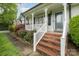 Inviting front porch with brick steps and white railing, perfect for relaxing and enjoying the outdoors at 106 S Oakwood Dr, Kings Mountain, NC 28086