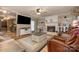 Open living room with a fireplace, hardwood floors, and comfortable seating, creating a warm and inviting atmosphere at 106 S Oakwood Dr, Kings Mountain, NC 28086
