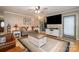 Comfortable living room with hardwood floors, TV, and seating arrangement, creating a relaxing atmosphere at 106 S Oakwood Dr, Kings Mountain, NC 28086
