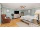 Bright main bedroom featuring hardwood floors, a ceiling fan, and neutral paint at 106 S Oakwood Dr, Kings Mountain, NC 28086