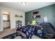 Bright bedroom with colorful decor, comfortable bed, and connecting bathroom at 10707 Charmont Pl, Huntersville, NC 28078