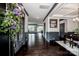 Spacious foyer featuring dark wood flooring, decorative trim, and an open layout at 10707 Charmont Pl, Huntersville, NC 28078