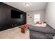 Comfortable living room with neutral walls, modern furniture, and bright natural light at 10707 Charmont Pl, Huntersville, NC 28078