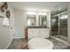 Bathroom features dual vanities, granite countertops, tiled floors, and a glass-enclosed shower at 10707 Charmont Pl, Huntersville, NC 28078