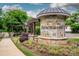 Stone Arbor Mere entrance sign with pergola and lush landscaping welcoming residents at 10707 Charmont Pl, Huntersville, NC 28078