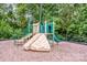 Community playground with slides, stairs, and climbing areas for hours of fun surrounded by mature trees at 10707 Charmont Pl, Huntersville, NC 28078