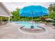Community pool with lounge chairs, tables, umbrellas, and a kid-friendly splash feature for summertime fun at 10707 Charmont Pl, Huntersville, NC 28078
