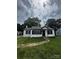 Quaint one-story home with black accents, complemented by a lush green lawn at 1104 Linwood Rd, Gastonia, NC 28052