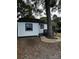 Quaint home with white siding, black trim, and mature trees, offering a cozy curb appeal at 1104 Linwood Rd, Gastonia, NC 28052