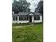 Charming white one-story home with black shutters and a newly replaced roof at 1104 Linwood Rd, Gastonia, NC 28052