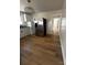 This modern kitchen includes granite counters, modern appliances, and beautiful hardwood floors at 1104 Linwood Rd, Gastonia, NC 28052